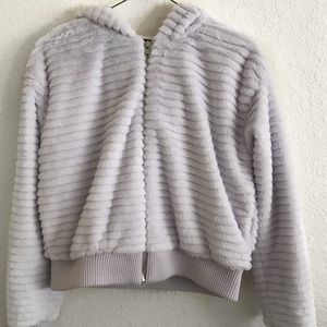 Light violet fluffy coat.